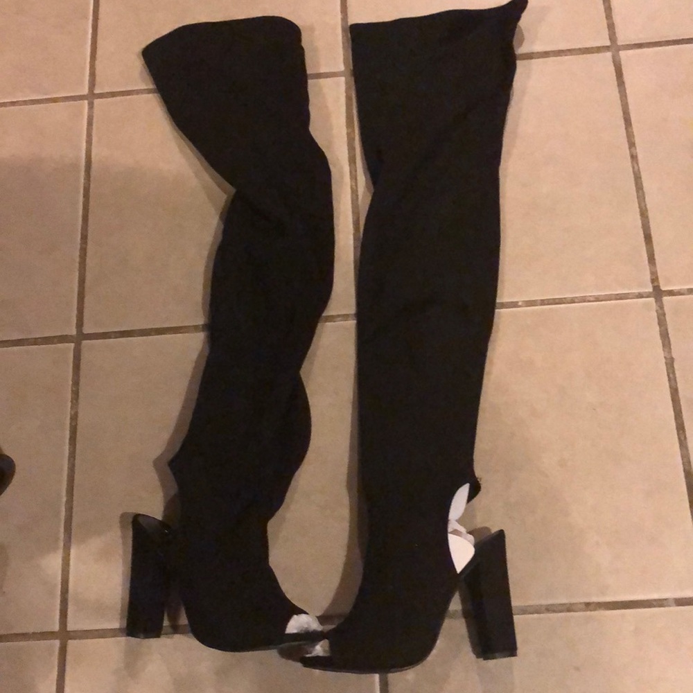 Black over the knee boots with a little heel